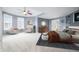 Bright main bedroom featuring a bay window, high ceilings, and stylish seating area at 1032 Westview Point Dr, Columbus, IN 47201