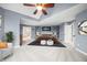 Relaxing main bedroom with high ceilings, contemporary furnishings, and an attached ensuite bathroom at 1032 Westview Point Dr, Columbus, IN 47201