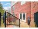 Cozy brick patio with outdoor seating and double doors leading inside at 1032 Westview Point Dr, Columbus, IN 47201