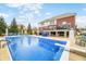 Outdoor in-ground pool with diving board and outdoor seating at 1032 Westview Point Dr, Columbus, IN 47201