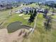 An aerial view of the golf course with surrounding natural beauty at 1086 Pebble Brook Dr, Noblesville, IN 46062