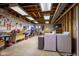 Unfinished basement with exposed pipes, a washing machine, and a work table at 1086 Pebble Brook Dr, Noblesville, IN 46062