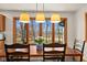 Bright dining area with large windows offering a scenic view at 1086 Pebble Brook Dr, Noblesville, IN 46062