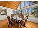 Sunlit dining room boasts a vaulted ceiling and large windows with lovely views of nature at 1086 Pebble Brook Dr, Noblesville, IN 46062