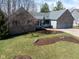 Charming brick home with a well-manicured lawn and a spacious two-car garage at 1086 Pebble Brook Dr, Noblesville, IN 46062