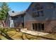 Back exterior view of a large home with a screen room, deck, and brick foundation at 1086 Pebble Brook Dr, Noblesville, IN 46062