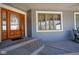 Inviting front porch featuring a beautifully crafted wood door and decorative trim at 1086 Pebble Brook Dr, Noblesville, IN 46062