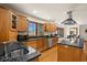 Well-appointed kitchen with granite counters, wood cabinetry, and stainless steel appliances at 1086 Pebble Brook Dr, Noblesville, IN 46062