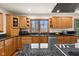 Updated kitchen with granite countertops, oak cabinets, and stainless steel appliances at 1086 Pebble Brook Dr, Noblesville, IN 46062