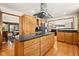 Spacious kitchen island with stainless steel range hood and granite countertop at 1086 Pebble Brook Dr, Noblesville, IN 46062