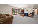 Large living room with plush couches and a sliding glass door to the outdoors at 1086 Pebble Brook Dr, Noblesville, IN 46062