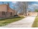 Backyard featuring a shed, brick accents, and well-maintained lawn at 12064 N Glena Pl, Mooresville, IN 46158