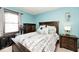 Cozy bedroom showcasing a comfortable bed, wooden furniture, and a tranquil ambiance at 12064 N Glena Pl, Mooresville, IN 46158