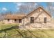 Charming single-story home featuring a brick facade, covered porch, and well-maintained lawn at 12064 N Glena Pl, Mooresville, IN 46158