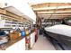 Well-organized garage with workbench, tools, and storage for a boat at 12064 N Glena Pl, Mooresville, IN 46158