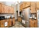 Well-appointed kitchen featuring stainless steel appliances, custom wood cabinets, and dark countertops at 12064 N Glena Pl, Mooresville, IN 46158
