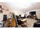Spacious room with a large TV, leather seating, electric fireplace, and workout equipment for recreation and relaxation at 12064 N Glena Pl, Mooresville, IN 46158