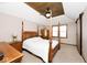 Charming main bedroom featuring a wood plank ceiling, fan, wooden furniture, and a four-poster bed at 12064 N Glena Pl, Mooresville, IN 46158