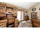 Home office space includes a built-in desk, cabinets, drawers, and adjacent dining area for flexible use at 12064 N Glena Pl, Mooresville, IN 46158