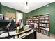 Spacious home office with a large desk, comfortable chair, and ample shelving for books and storage at 12064 N Glena Pl, Mooresville, IN 46158