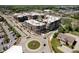 Stunning aerial view of luxury apartments near roundabouts and green spaces showcasing urban living at 15 W Executive Dr # 104, Carmel, IN 46032