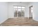Bright bedroom with a balcony, wood floors, and a modern aesthetic at 15 W Executive Dr # 104, Carmel, IN 46032