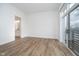 Bright bedroom with a balcony, wood floors, and a modern aesthetic at 15 W Executive Dr # 104, Carmel, IN 46032