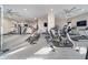 A spacious gym featuring multiple treadmills, bikes, weight machines, and fitness equipment at 15 W Executive Dr # 104, Carmel, IN 46032