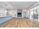 Spacious open concept layout, a modern kitchen, gas fireplace with ship lap accent wall, and large sliding glass doors at 15 W Executive Dr # 104, Carmel, IN 46032