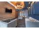 Cozy lounge area featuring modern lighting, comfortable seating, and a balcony at 15 W Executive Dr # 104, Carmel, IN 46032