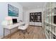 Modern office space with sleek white desk, stylish chair, and ample storage with a bookshelf at 15 W Executive Dr # 104, Carmel, IN 46032