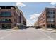 Exterior view of parking spaces between two brick buildings at 15 W Executive Dr # 104, Carmel, IN 46032
