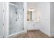 Bright bathroom featuring a glass enclosed shower with marble tile at 15 W Executive Dr # 104, Carmel, IN 46032