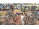 Birds eye view of a single story residential neighborhood with bare trees and fallen leaves on the ground at 1852 W 62Nd St, Indianapolis, IN 46260