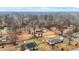 Aerial neighborhood view showing houses with mature trees throughout the area at 1852 W 62Nd St, Indianapolis, IN 46260