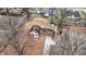 Aerial shot of home with long driveway surrounded by trees and seasonal foliage at 1852 W 62Nd St, Indianapolis, IN 46260
