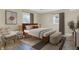 Cozy bedroom featuring a modern bed frame, stylish bedside lamps, and two windows for natural light at 1852 W 62Nd St, Indianapolis, IN 46260