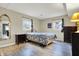 Bright bedroom featuring neutral walls and modern hard surface floors at 1852 W 62Nd St, Indianapolis, IN 46260