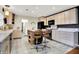 Kitchen showcasing stone countertops, modern appliances and wood-look tile flooring at 1852 W 62Nd St, Indianapolis, IN 46260