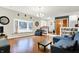 Sunlit living room showcasing hardwood floors, built-in shelving, and a cozy window seat at 1852 W 62Nd St, Indianapolis, IN 46260