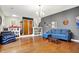 Spacious living room features gleaming hardwood floors and neutral gray walls at 1852 W 62Nd St, Indianapolis, IN 46260