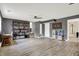 Spacious living room with gray walls, a ceiling fan, and modern, light flooring at 1852 W 62Nd St, Indianapolis, IN 46260