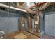 Basement featuring water heater, furnace, and possible storage space at 2312 Fletcher St, Anderson, IN 46016