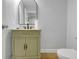 Updated bathroom features granite countertop and cabinet and updated toilet at 2312 Fletcher St, Anderson, IN 46016