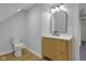 Bathroom features modern vanity with light wood cabinetry and white countertop at 2312 Fletcher St, Anderson, IN 46016