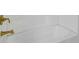 Clean, white bathtub with gold fixtures, ready for a relaxing soak at 2312 Fletcher St, Anderson, IN 46016