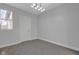Neutral bedroom offers natural light and neutral carpeting at 2312 Fletcher St, Anderson, IN 46016