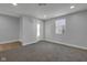 Cozy bedroom with soft gray walls, plush carpeting, and ample natural light at 2312 Fletcher St, Anderson, IN 46016