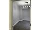 This bedroom has gray walls, gray carpet and a modern light fixture at 2312 Fletcher St, Anderson, IN 46016