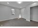 Well-lit bedroom with a window, fresh paint, and new carpet flooring at 2312 Fletcher St, Anderson, IN 46016